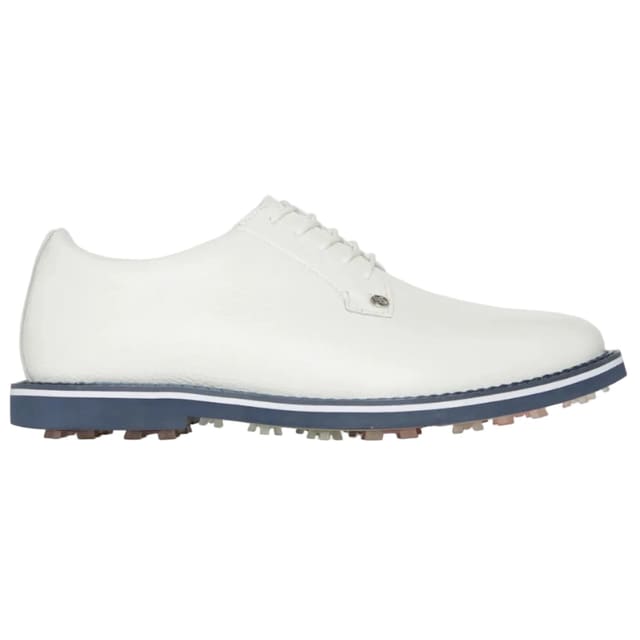 White golf shoe with a blue sole on a light gray background