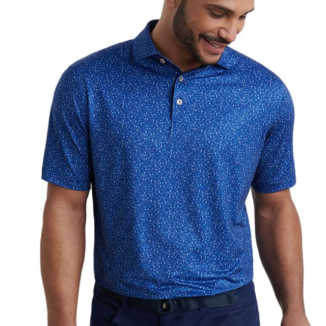 Man wearing a blue patterned polo shirt on a white background